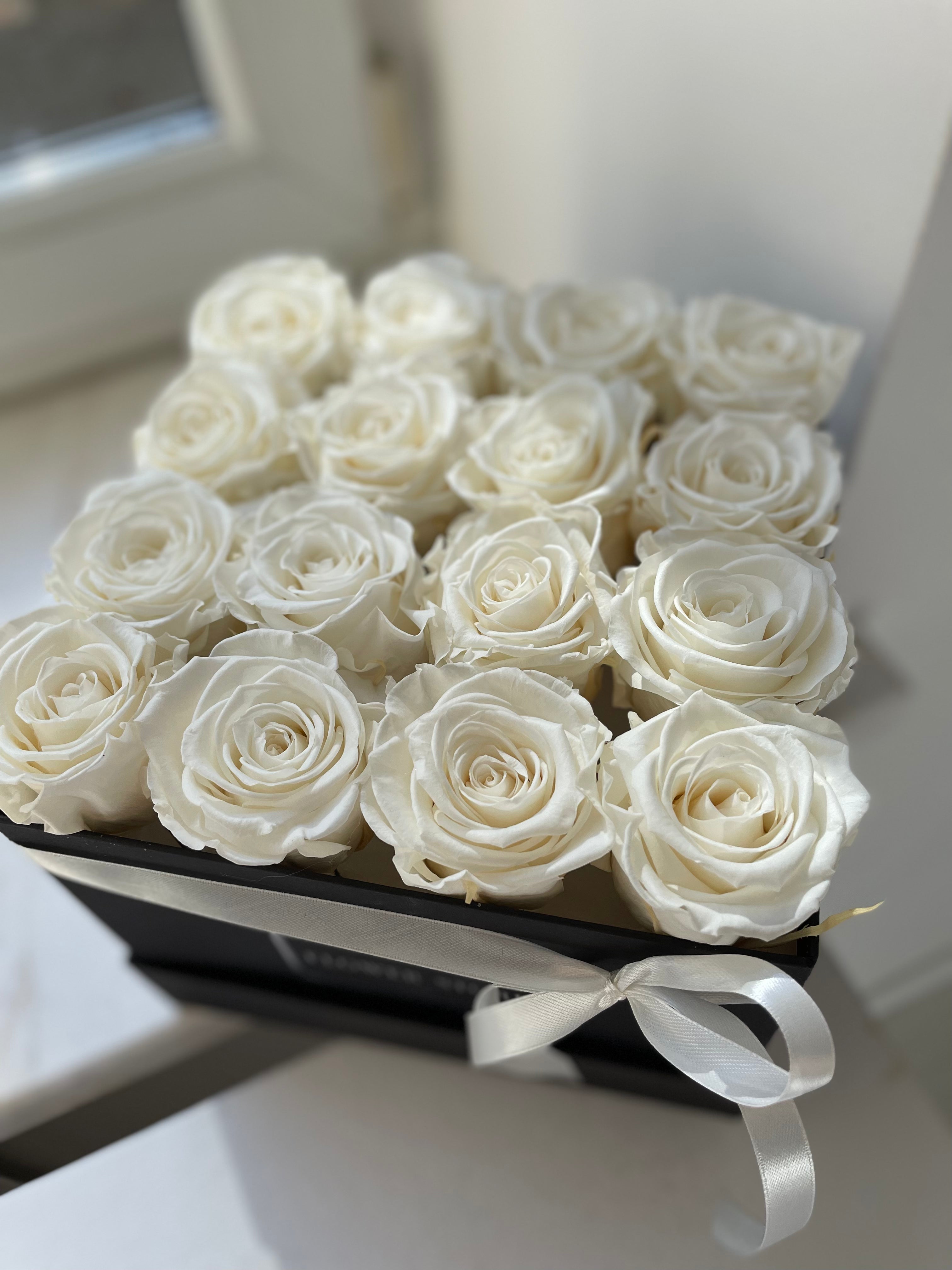 Square black box with white eternal roses